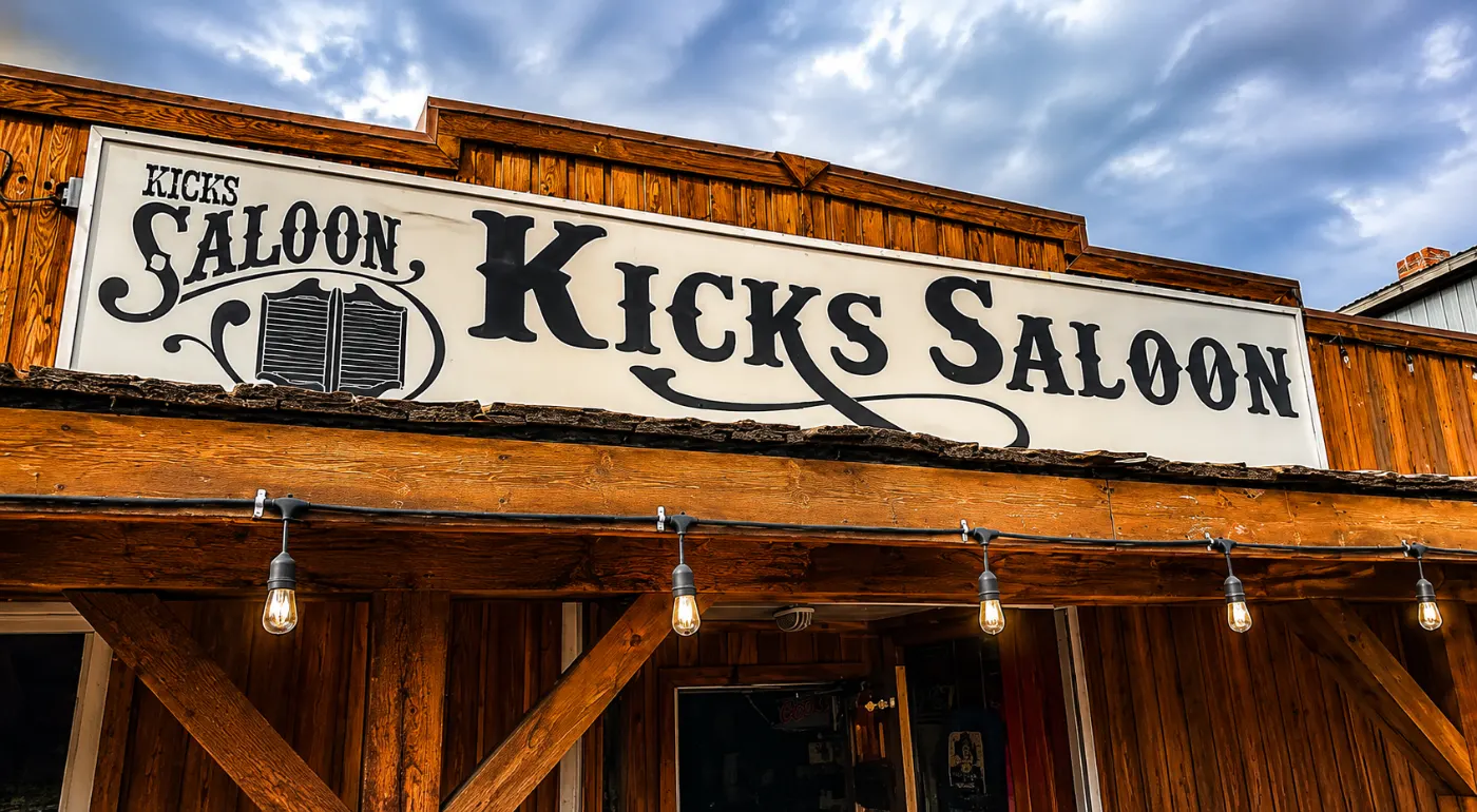 The hand-painted Kicks Saloon sign above the timber storefront